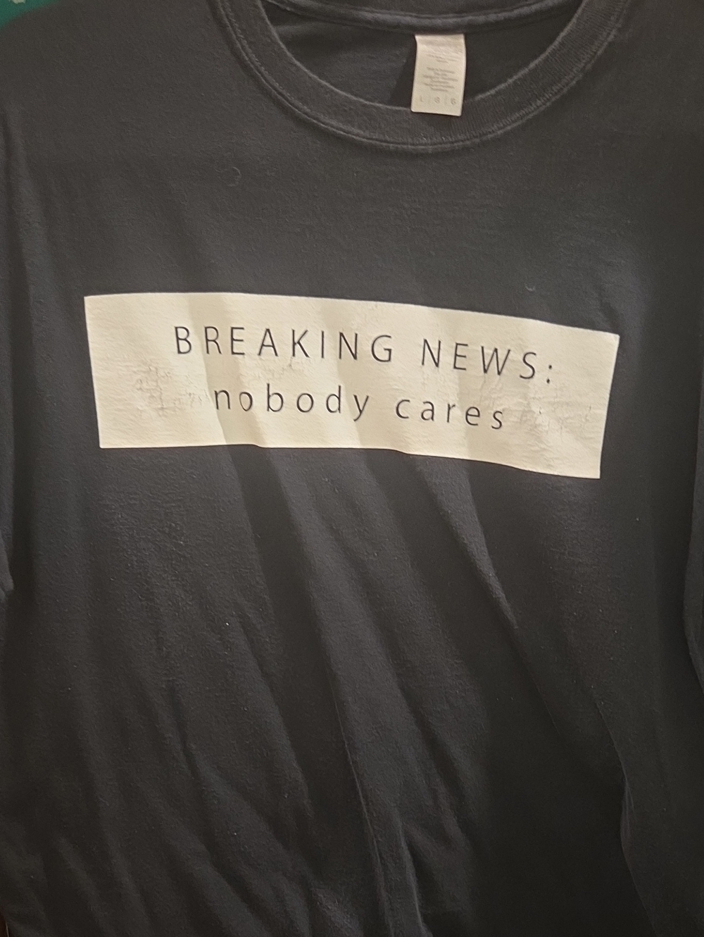 Black Graphic Tee "BREAKING NEWS: nobody cares"